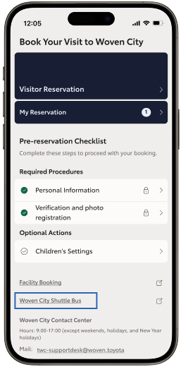 The Woven City App home screen with the "Woven City Shuttle Bus" hyperlink highlighted on a smart phone
