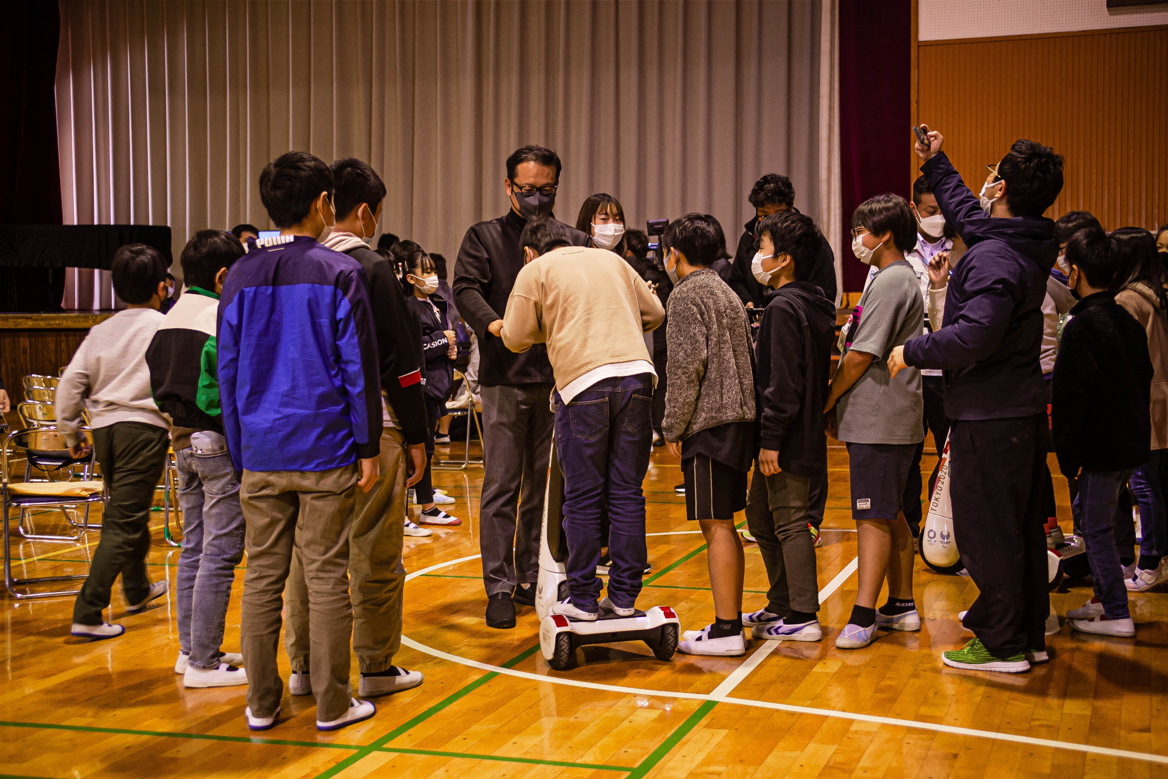 Photo of students trying out personal mobility vehicles