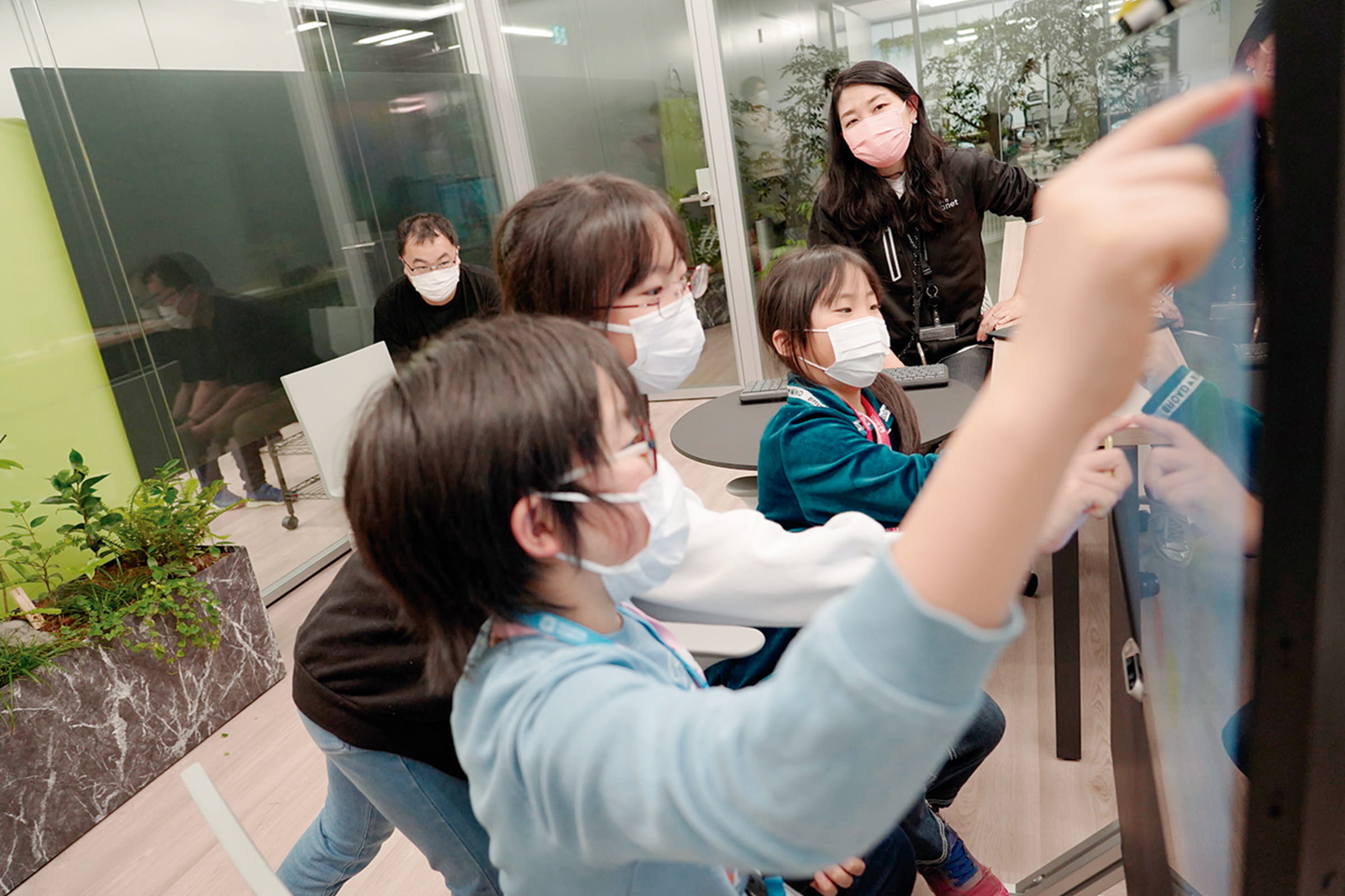Photo of children testing next-gen remote communications at the office